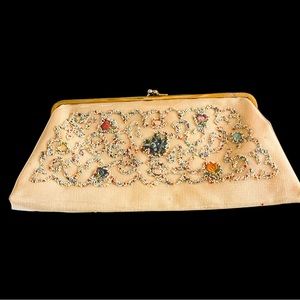 Antique 1950’s clutch bag. Floral seeds with clear coating